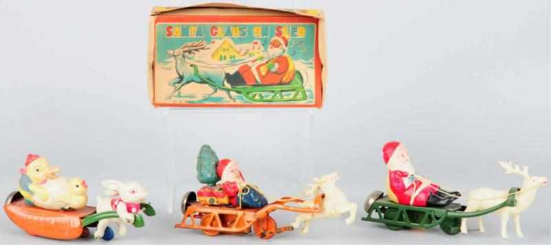 Appraisal: Lot of Celluloid Tin Holiday Wind-Up Toys Japanese Working Includes