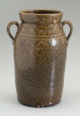 Appraisal: Stoneware jar two strap handles mottled olive alkaline glaze straight