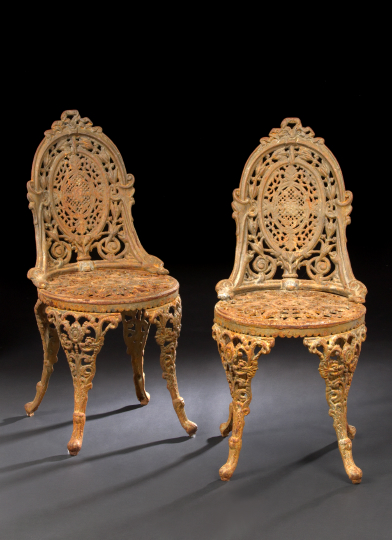 Appraisal: Pair of Victorian-Style Cast-Iron Garden Chairs each with a medallion