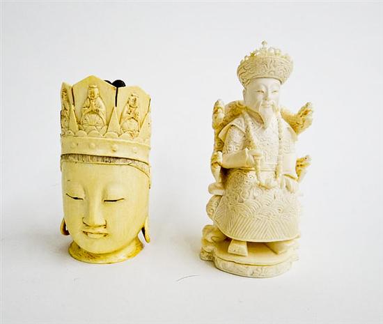 Appraisal: TWO IVORY CARVINGS China st half- th century Buddha head