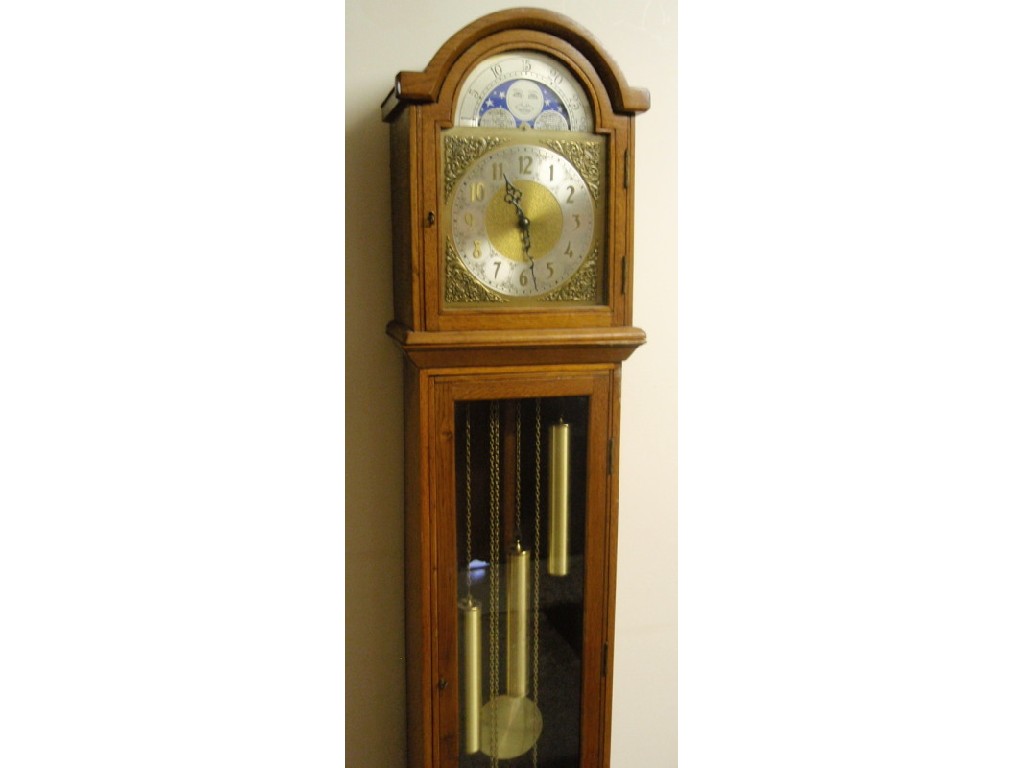 Appraisal: A modern oak cased three train long case clock cm