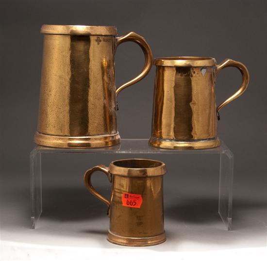 Appraisal: Three English brass graduated tankards late th early th century