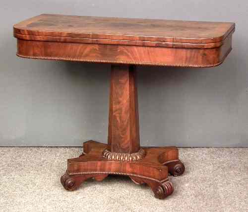 Appraisal: An early Victorian mahogany D-shaped card table on central pedestal