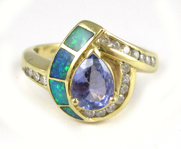 Appraisal: TANZANITE OPAL DIAMOND AND FOURTEEN KARAT GOLD RING inlaid with