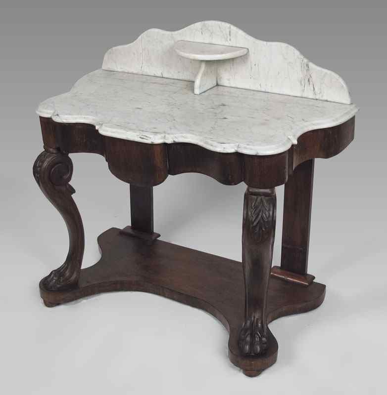 Appraisal: MARBLE TOP VICTORIAN TABLE Shaped white marble top and backsplash