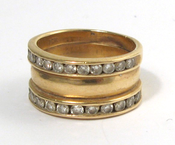 Appraisal: DIAMOND AND FOURTEEN KARAT GOLD RING set with two channels