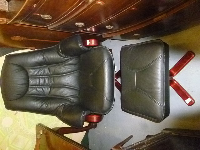 Appraisal: A DANISH BLACK LEATHER UPHOLSTERED RECLINING ARMCHAIR together with a