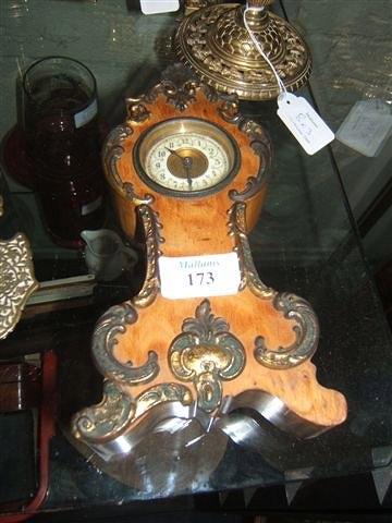 Appraisal: A French walnut and gilt metal rococo mantel clock with