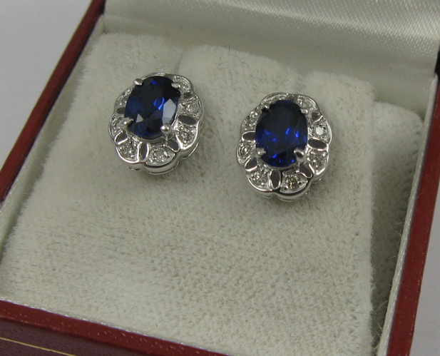 Appraisal: PAIR OF SAPPHIRE DIAMOND AND K GOLD EARRINGS Each white