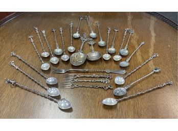 Appraisal: An ornate lot of European long silver spoons serving spoons