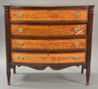 Appraisal: Sheraton mahogany bowed front chest of four drawers with figured