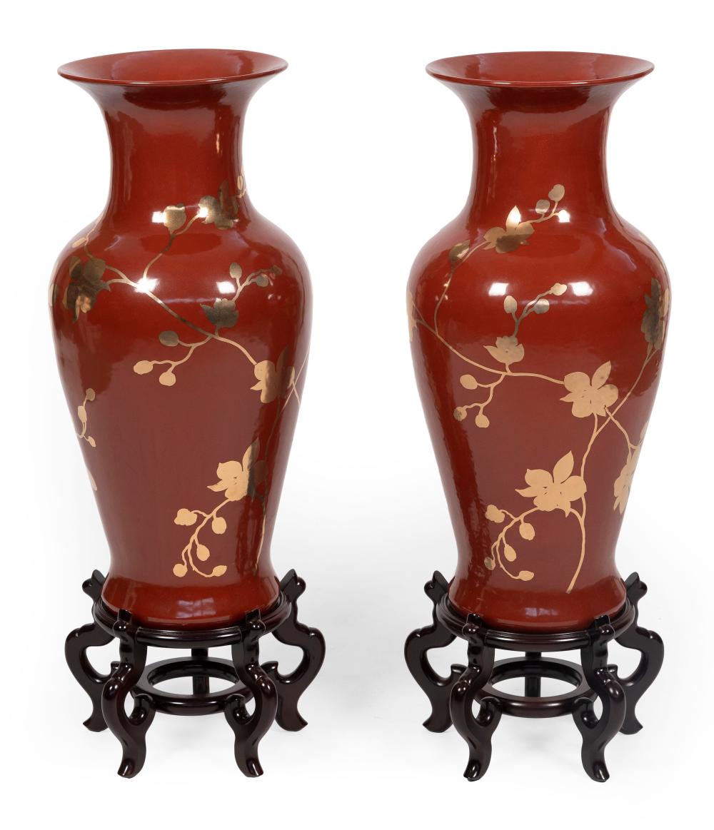 Appraisal: PAIR OF ASIAN-INSPIRED RED AND GILT PORCELAIN PALACE VASES TH