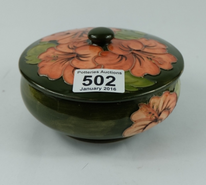 Appraisal: Moorcroft lidded dish in hibiscus on green ground design cm