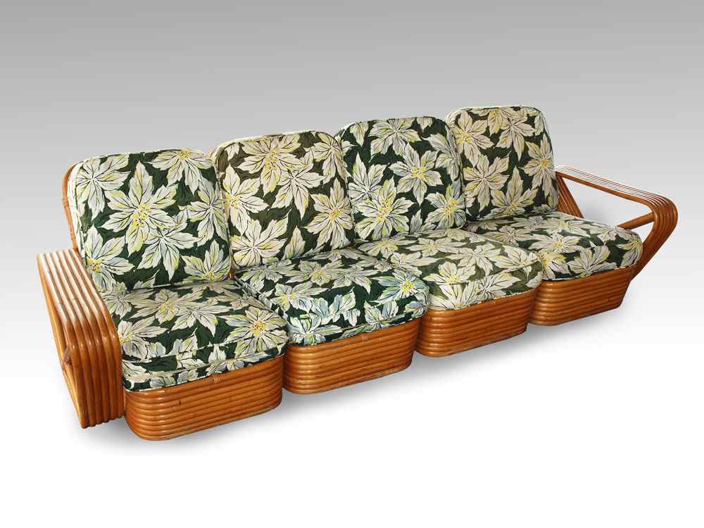 Appraisal: PAUL FRANKL STYLE FOUR SECTION BAND RATTAN SOFA Overall ''