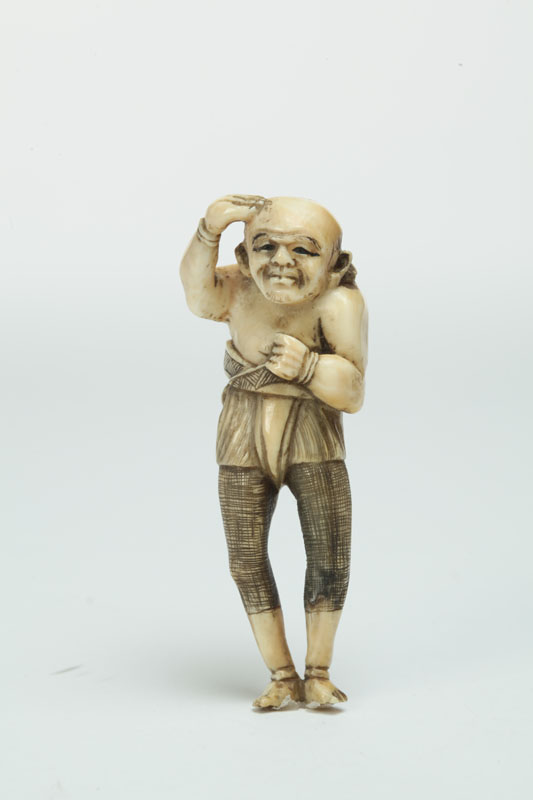 Appraisal: IVORY NETSUKE Japan st half- th century Elongated figure of