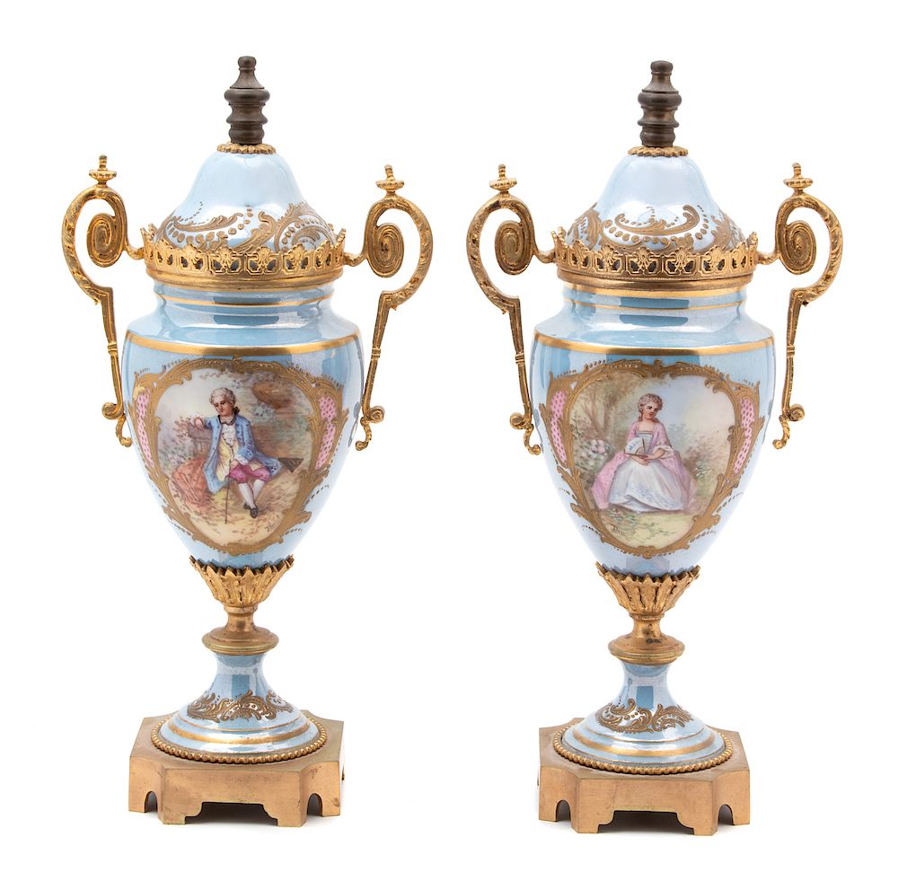 Appraisal: A Pair of Sevres Style Gilt Bronze Mounted Porcelain Urns