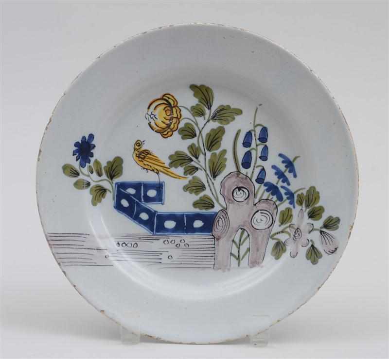 Appraisal: LIVERPOOL DELFT POLYCHROME PLATE Circa painted in a ''Fazackerly'' palette