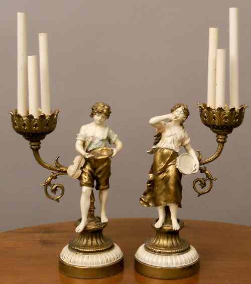 Appraisal: A pair of gilt and painted metal three light electroliers