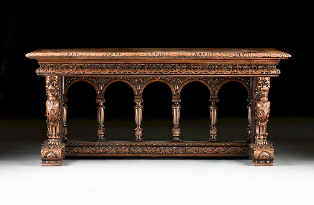 Appraisal: AN ITALIAN RENAISSANCE REVIVAL CARVED WALNUT LIBRARY TABLE EARLY TH