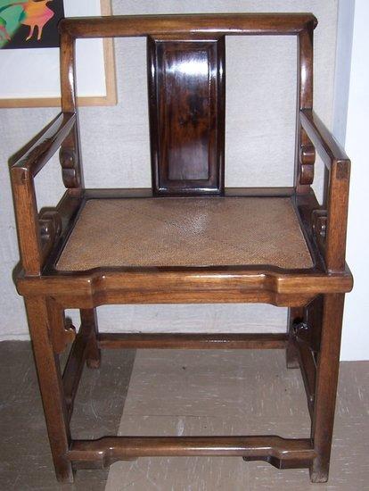 Appraisal: A pair of Chinese hardwood armchairs in early Qing style