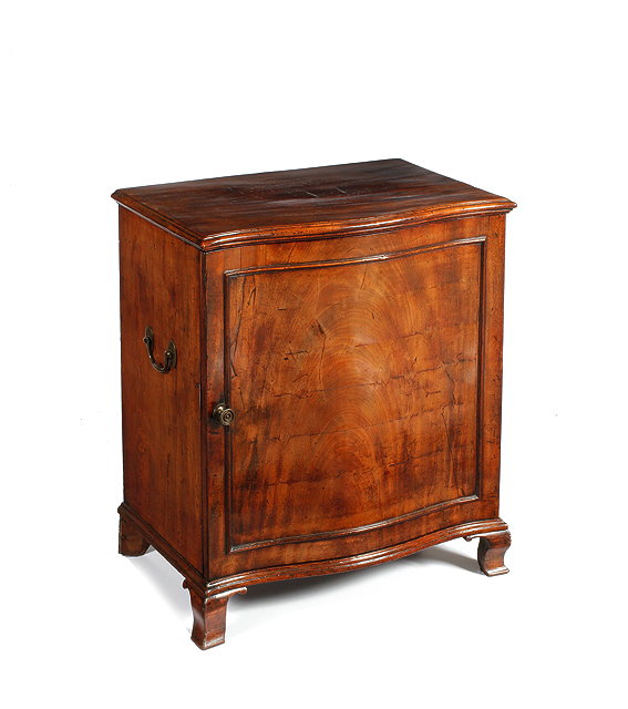 Appraisal: A GEORGE III MAHOGANY SERPENTINE FRONTED HOT PLATE CUPBOARD the