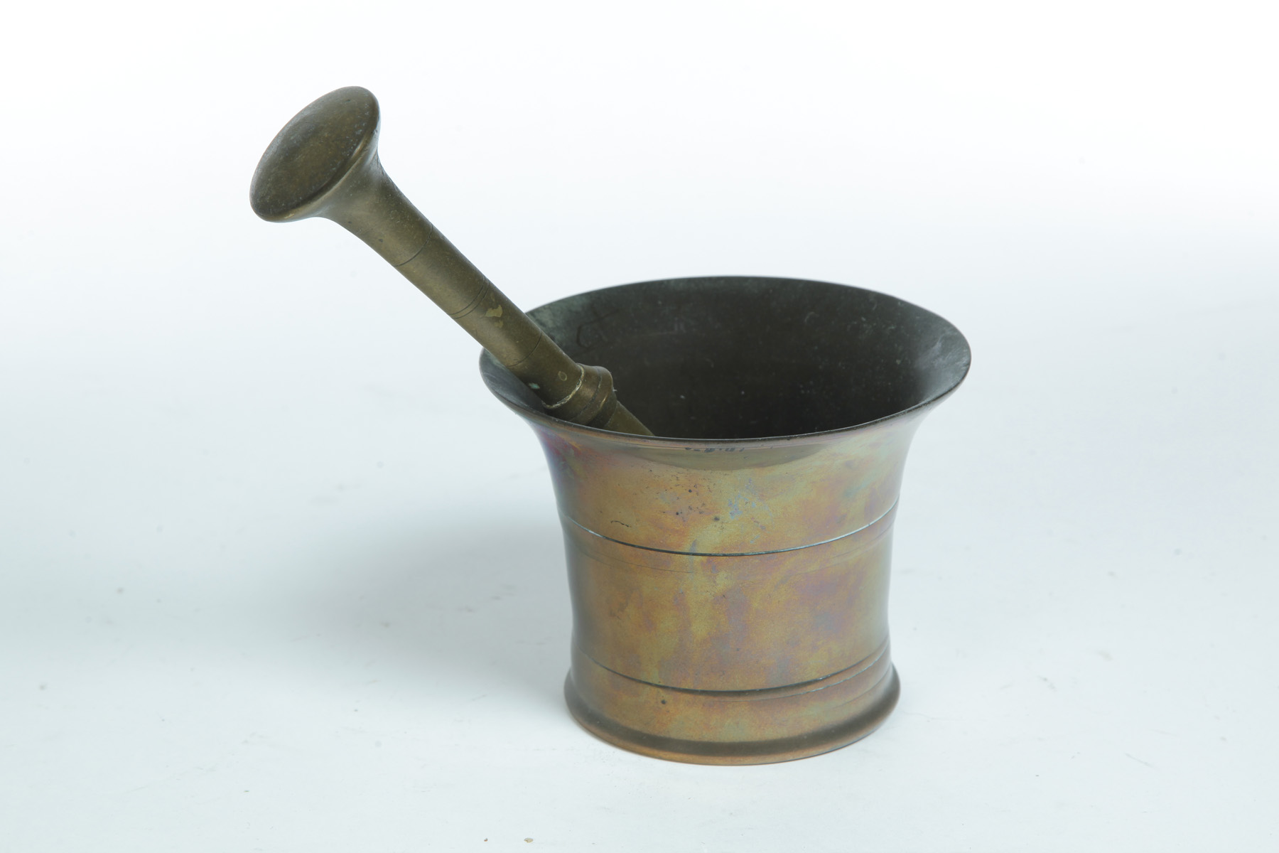 Appraisal: BRASS MORTAR AND PESTLE American or European th century Flared