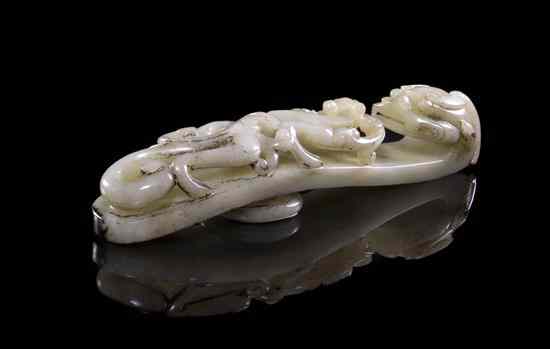 Appraisal: A Carved Jade Belt Hook of white and black colored