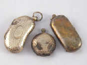 Appraisal: Three silver sovereign cases a kidney shaped double with hammered