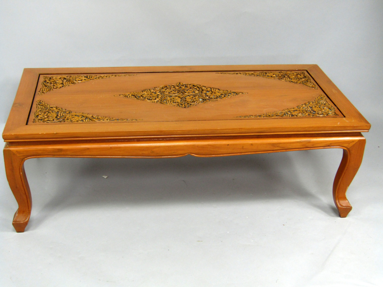 Appraisal: An Indonesian carved hardwood rectangular low centre table with carved