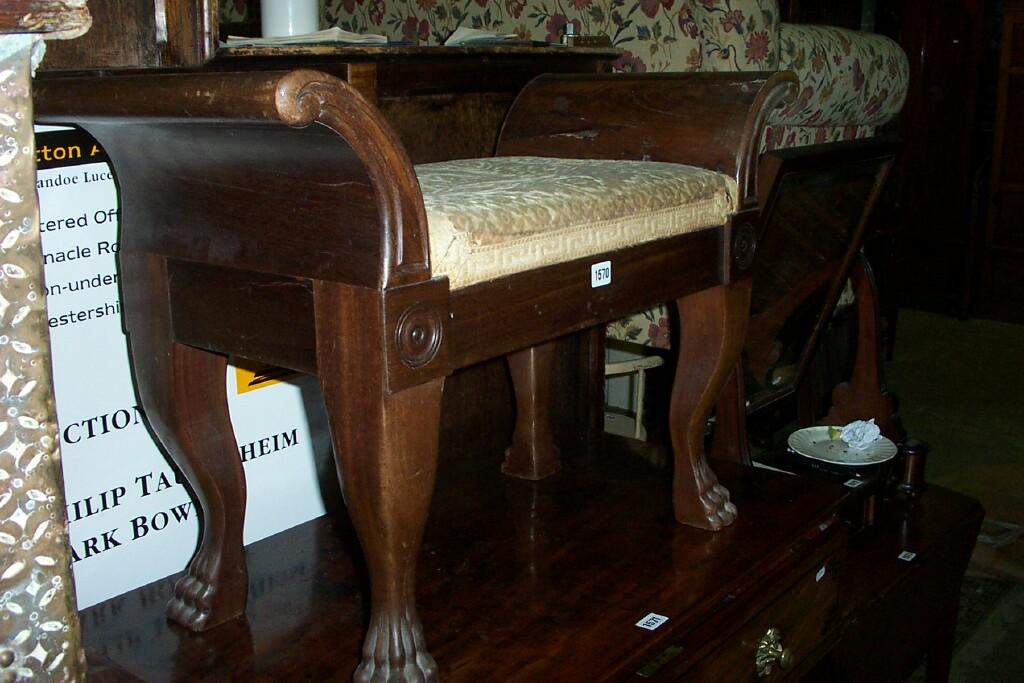 Appraisal: A Regency style stool with swept arms raised on four