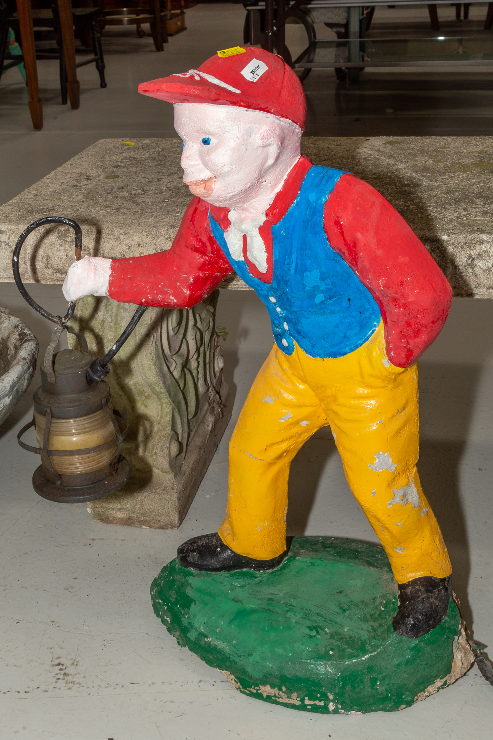 Appraisal: CEMENT LAWN JOCKEY PATH LIGHT th century modeled as a