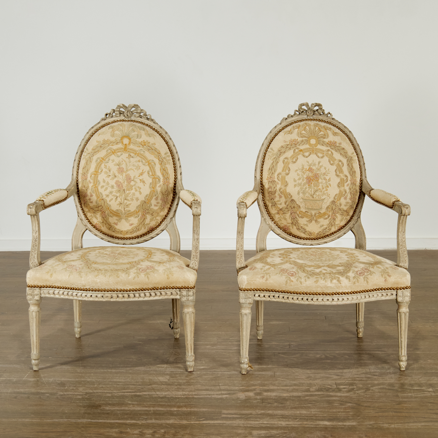 Appraisal: PAIR LOUIS XVI GRAY PAINTED FAUTEUILS th th c oval