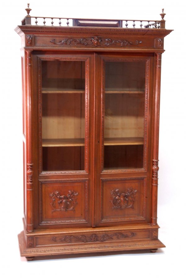 Appraisal: Bookcase Two glass doors over single drawer Fluted columns Turned