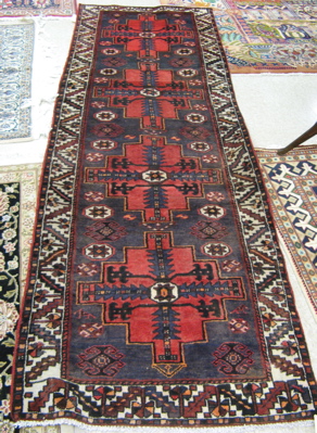 Appraisal: PERSIAN TRIBAL RUNNER Hamadan villages region overall geometric design on