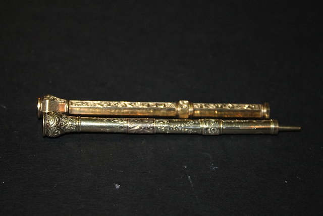 Appraisal: TWO TH CENTURY GILT PROPELLING PENCILS with engraved decoration one