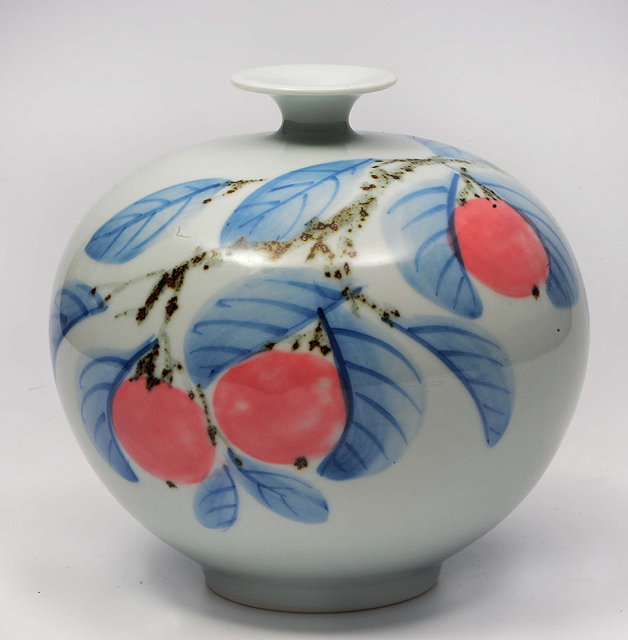 Appraisal: A JAPANESE PORCELAIN OVOID VASE decorated with peaches on a