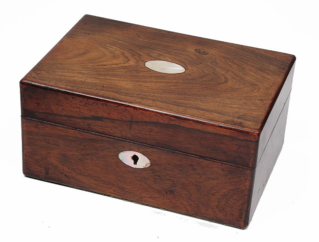 Appraisal: A Victorian rosewood sewing boxthe interior with fitted compartments and