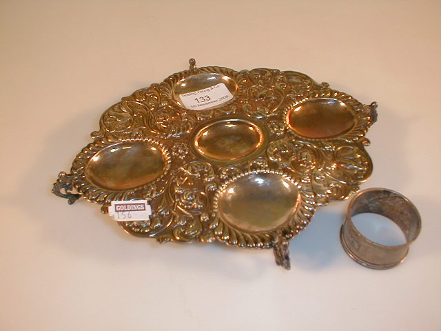 Appraisal: A silver stand and napkin ring