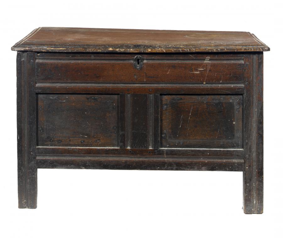 Appraisal: A CHARLES II JOINED OAK CHEST with moulded lid and