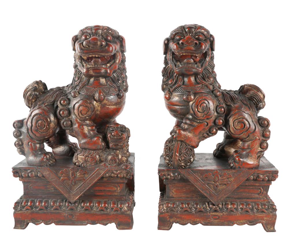 Appraisal: PAIR OF CHINESE CARVED LACQUERED WOOD LIONSunsigned Provenance Property from