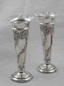 Appraisal: A pair of embossed silver spill vases by William Comyns