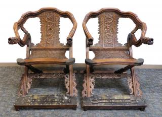 Appraisal: Pair Huanghuali Ziaoyi Pair Huanghuali Ziaoyi Highly carved folding chairs