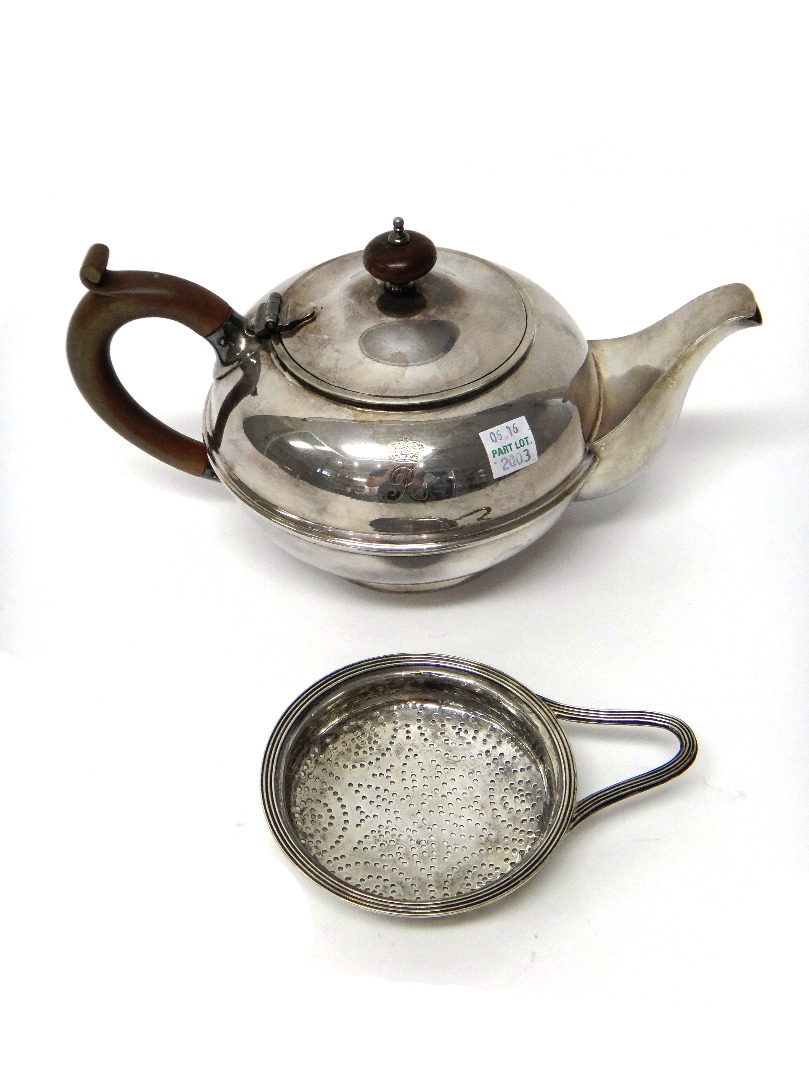 Appraisal: A George III silver strainer of circular form London weight