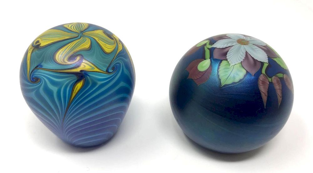 Appraisal: Two Floral Iridescent Art Glass Paperweights One Orient Flume Lot