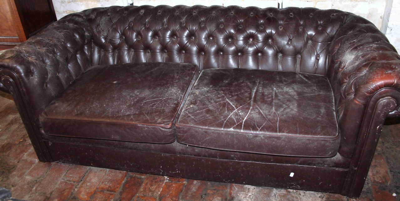 Appraisal: An early thC brown leather Chesterfield of D-end outline with