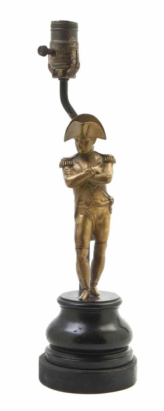 Appraisal: A Continental Gilt Metal Figure depicting a standing Napoleon Bonaparte