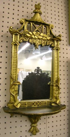 Appraisal: Pair of Asian influence wall shelves with mirrors and carved