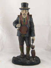 Appraisal: A pedlar style painted spelter and plaster figure watch stand