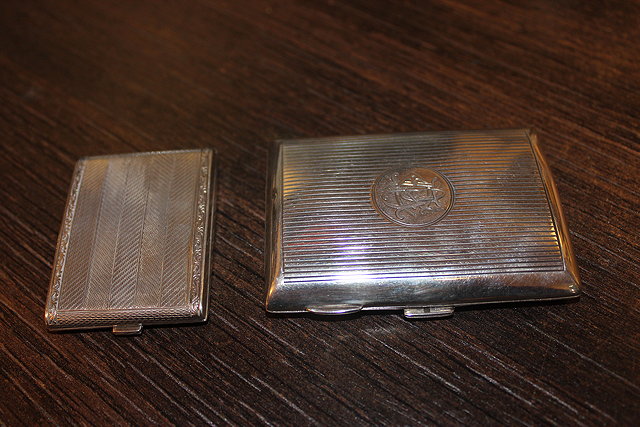 Appraisal: A SMALL SILVER CIGARETTE CASE together with a silver match