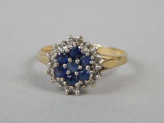 Appraisal: A sapphire and diamond cluster dress ring mounted in ct